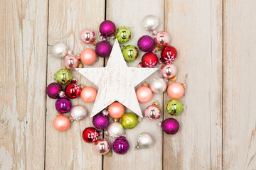 white star between christmas balls