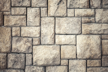 Background texture of old brown decorative stone wall