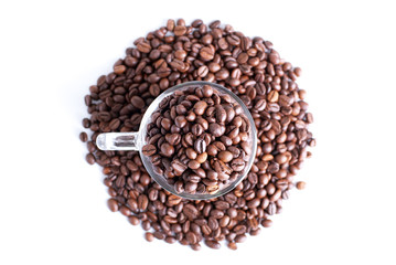 coffee beans in a glass cup isolated on white background