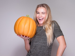 Fototapeta na wymiar Happy woman with pumpkin