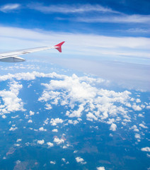 Skies above and below Plane in the Air