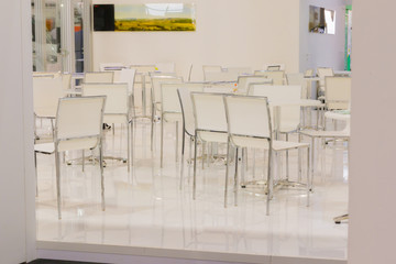 white Table and chair set in empty modern cafe