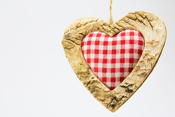 wooden heart, squared textile in the middle