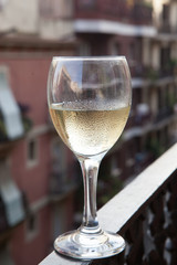 Glass of white wine on the balcony