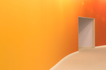 orange wall and open entrance in a empty room