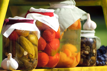 Shelf with canned fruit and vegetable