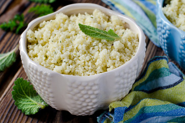 Cous cous with herbs in a ceramic bowl