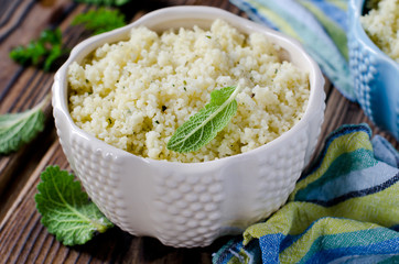 Cous cous with herbs in a ceramic bowl