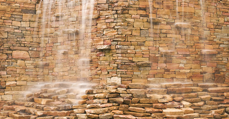 Water Cascading Over Stone Wall