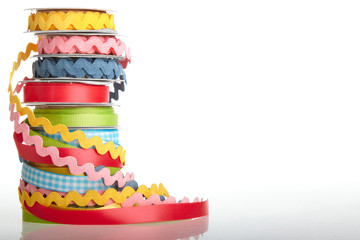 colorful ribbon rolls on white