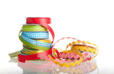 colorful ribbon rolls on white