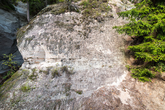sandstone cliffs with inscriptions