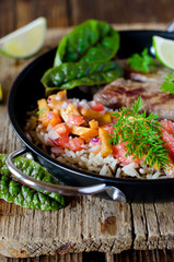 Baked meat with rice and tomato-peach salsa