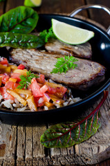 Baked meat with rice and tomato-peach salsa