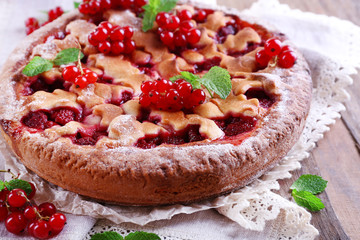 Tasty cake with berries on table close-up