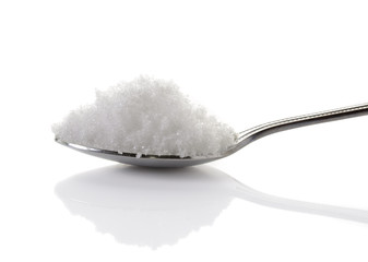 sea salt in spoon on white background