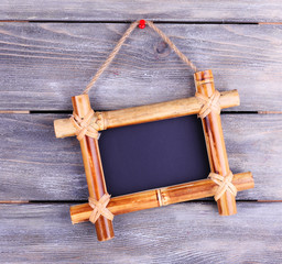 Rectangular chalkboard on wooden background