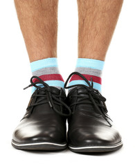 Man leg in suit and colorful socks, isolated on white