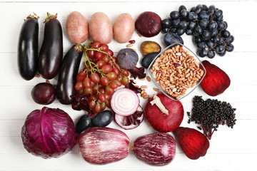 Fresh organic vegetables on wooden table, close up