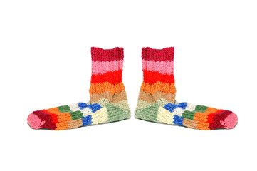 Warm knitted woolen socks knitting needles isolated on a white b