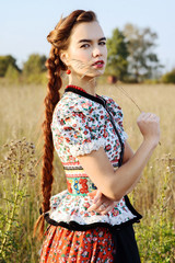 Young peasant woman, dressed in Hungarian national costume