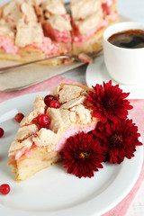 Piece of tasty pie with apples and berry mousse and cup of
