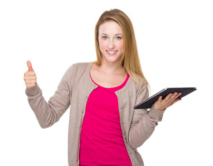 Woman with tablet and thumb up