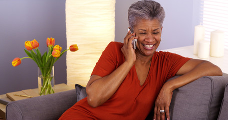 African grandmother talking on smartphone