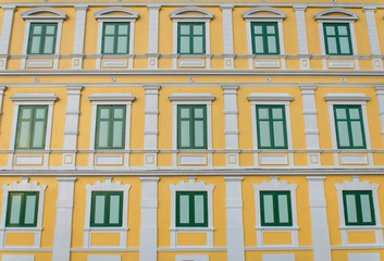 Fototapeta na wymiar yellow windows wall for background