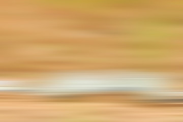 abstract warm yellow background motion blur