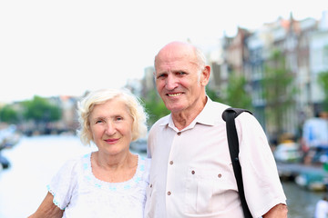 Happy senior couple enjoying Amsterdam sightseeing