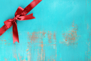 Old wooden background with beautiful bow