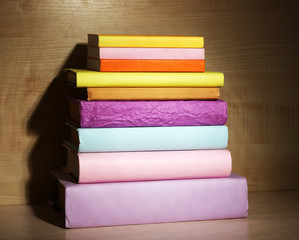 Books on wooden shelf close-up