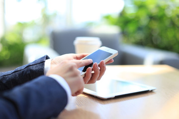 Modern workplace with digital tablet computer and mobile phone