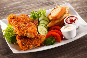Fried chicken nuggets and vegetables