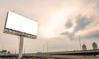 large blank billboard on road with city view background