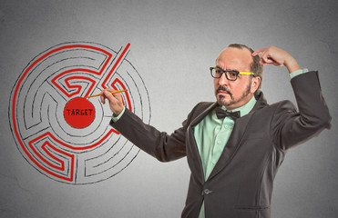 Target man looking for labyrinth path to reach success