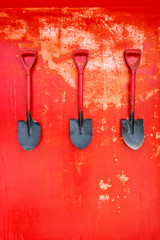 fire Shovel on red wall