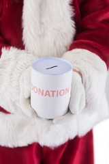 Obraz na płótnie Canvas Santa holds a can for donations