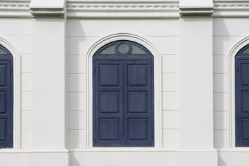 Old window with blue shutters. Background.