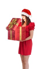 Surprised festive brunette holding a gift