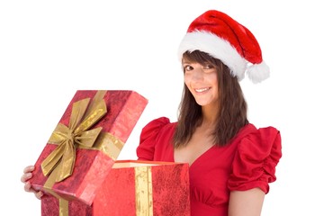 Festive brunette holding a gift