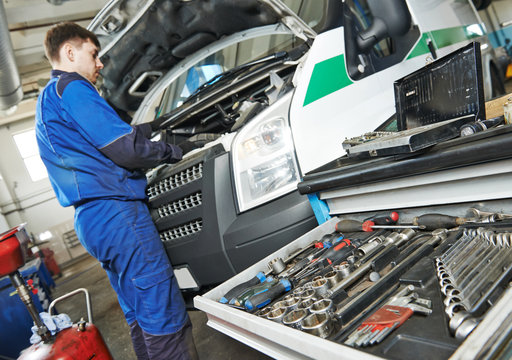 repairman servicing auto car