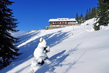 Fototapeta na wymiar Winter at mountain chalet
