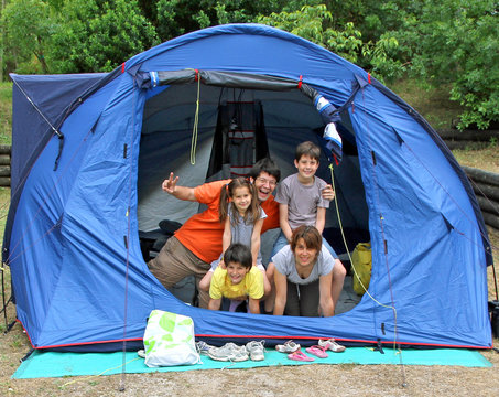 Happy Family Of Five In The Tent Camping