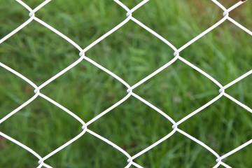 Fototapeta premium Steel net fence with blur background