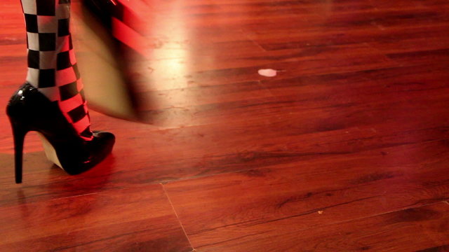 Feet of Go-Go dancers girls at the disco