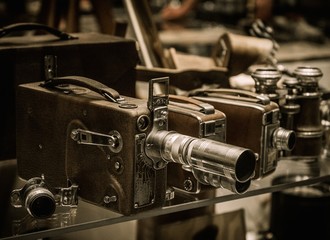 Fototapeta na wymiar Vintage cameras and lenses on a shelf