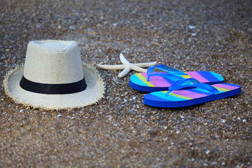 Summer straw hat with slippers and star fish