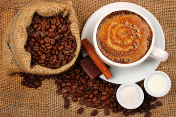 Fresh cup of black coffee with milk and sugar
